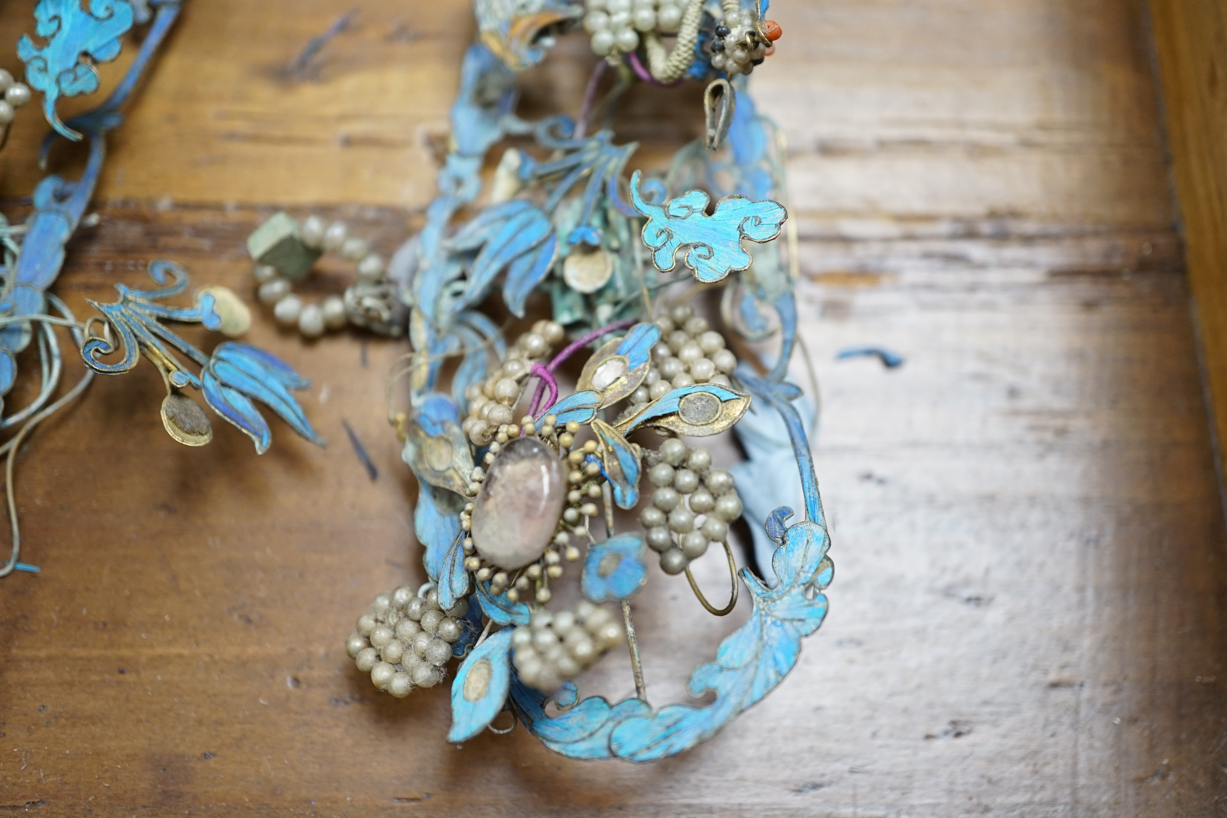 A group of eight Chinese kingfisher feather, jade, seed pearl, coral and hardstone mounted headdresses and ornaments, late Qing dynasty, some losses